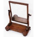 A Victorian mahogany framed dressing table mirror, the rectangular mirror plate on two supports, on