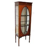 An Edwardian mahogany display cabinet, the tall cabinet with painted detailing of roses, with an ova