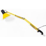 A table mounted angle poise lamp, in yellow, 93cm long.