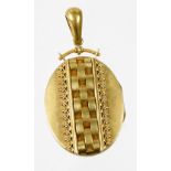 A Victorian bloomed gold locket, with oval frontage with central three weave interlinked design, wit