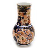 A late 19thC Japanese Imari porcelain vase, the main body on a blue ground with Imari type detailing