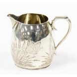 A Victorian silver cream jug, with engraved detailing of ferns, Birmingham 1878, 3¼oz, 6cm high.