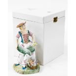 A Royal Crown Derby boxed figure of The Flower Seller, in flowing dress holding daffodils, signed J