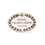 A Royal Crown Derby retailers' plaque, oval with red Royal Crown Derby England stamp to centre, 10.5