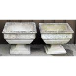 Two reconstituted stone rectangular garden planters, each with a ribbed border above rose detail on
