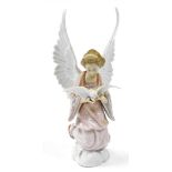 A Lladro figure of an angel holding a dove, 30cm high.