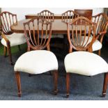 A mahogany dining room suite, comprising a twin pedestal dining table, with additional leaf and marq