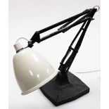 An anglepoise desk lamp, with a cream shade on black base and arched leaver movement, 41cm high when