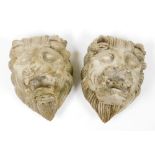 Two resin lion masks, 12cm high.