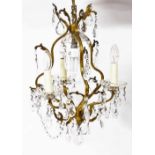 A gilt six branch crystal chandelier, 50cm high.