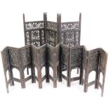 Two pierced and carved Eastern design screens, to include a three panel rectangular screen with leaf