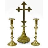 A large Victorian jewelled brass altar cross, inset with blue stones, 62cm high, and a pair of assoc