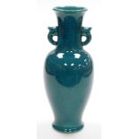 A Chinese porcelain turquoise crackle glazed baluster vase, with two 'ear' handles, 38cm high.
