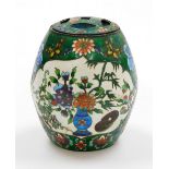 A Chinese cloisonné incense burner and pierced cover, on a green ground with flower and butterfly de