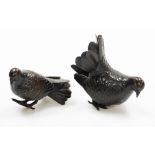 A pair of small Japanese bronze figures of doves, Meiji/Taisho period, 7cm high. (AF)