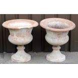 Two Victorian terracotta garden urns, each with flared bowl on tapered stem base, 55cm high. (AF)