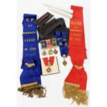 A group of Masonic memorabilia, comprising two induction certificates, red medal and sash, blue sash