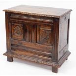 A 19thC continental oak and walnut coffer, with gadroon moulded lift top, scoop carved framing enclo