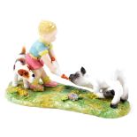 A Royal Crown Derby figure group, of a child feeding a lamb with dog, with red stamp to underside,