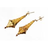 A pair of Victorian style drop earrings, each in the form of a drop with applied floral detailing, g