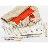 A silver and mother of pearl handled ten piece knife and fork set, the knife ends and blades being s