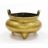A Chinese bronze tripod censer, with two loop handles, cast mark with lengthy inscription, 13cm high