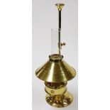 A brass table lamp, with a domed shade converted from an oil lamp, 59cm high.