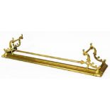 A Victorian Art Nouveau brass fire curb, of D end form, with elaborate scroll top and cylindrical ce