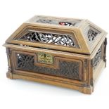 A Victorian fretwork carved walnut gothic casket, the top bearing the initials ES, with key lock and