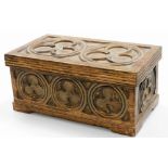 A Gothic stained oak box, the carving of trefoil design, 16cm high, 35cm wide, 20cm deep.