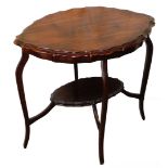 A Victorian walnut occasional table, with lozenge shaped top with piecrust border and under shelf, o