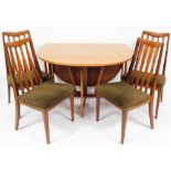 A G Plan light oak drop leaf dining table and four associated dining chairs, the table 73cm high, 10