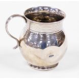 A George V silver pot bellied christening mug, bearing the initials MYP, dented, London 1927, (AF),