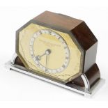 A Goldsmiths and Silversmiths Company Art Deco mantel clock, with octagonal front shield on gold col