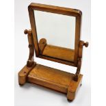 A Victorian satin walnut swing framed dressing table mirror, with rectangular plate, on a stepped ba