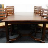 A mahogany and chequer banded dining table, in three sections on square tapering legs with flat stre