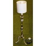 A brass table lamp, on tripod base, with white shade.