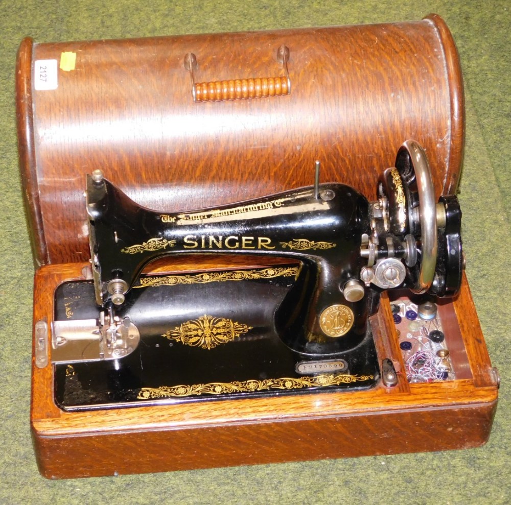 A cased Singer sewing machine.