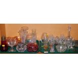 A group of glassware, to include a cranberry glass jar and cover, sugar shaker, Carnival glass bowl,