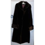 A brown full leather fur coat.