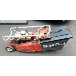 A Mountfield vintage petrol lawnmower.