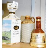 A group of decanters, to include The St Andrews Golfing decanter, Bells Old Scotch Whisky and a Scru
