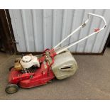 A Mountfield vintage petrol lawnmower.