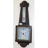 An oak cased wall barometer.