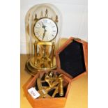 A modern brass sexton in wooden case and a Kundo Anniversary clock. (2)