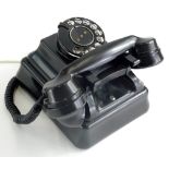 An ATM black Bakelite telephone, numbered L111186.B9, 15cm wide. (AF)