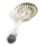 A George III silver caddy spoon, by John Turner, the bowl decorated with a radiating pattern, with a