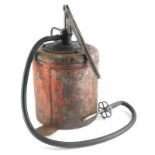 A red painted garage oil pump, pre 1950.
