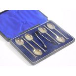 A set of six George V silver teaspoons and sugar nips, with seal top handles, Sheffield 1921, boxed,