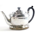 A George III silver teapot, by Abstinando King, with bright cut decoration and crest within a cartou
